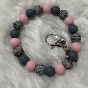 Pink and gray Aztec wristlet